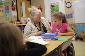 teacher working with a student one on one